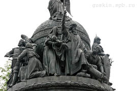A monument to thousandth anniversary of Russia (1862). «The Christianization of Rus». In the center, the Kievan Grand Prince Vladimir the Great raises an Orthodox cross. Besides, a woman holds her child for baptism and a Slav dispossesses the pagan god Perun. 